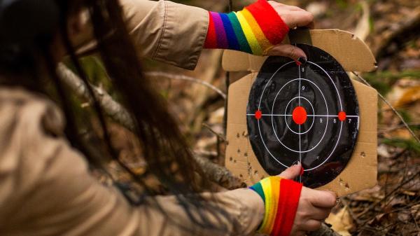 From Washington Post: "Finley Smith, a trans woman and gun advocate, places a target in the woods for firearm safety drills at Pawtuckaway State Park in Nottingham, N.H. (Adam Glanzman for The Washington Post)"